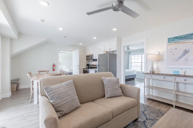 living room with ceiling fan, light wood-type flooring, baseboards, and recessed lighting