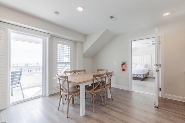 dining space with baseboards, recessed lighting, visible vents, and light wood-style floors