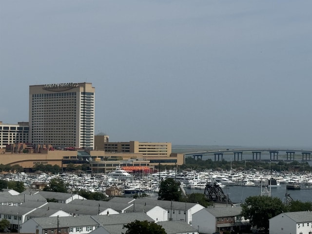 birds eye view of property with a water view and a city view