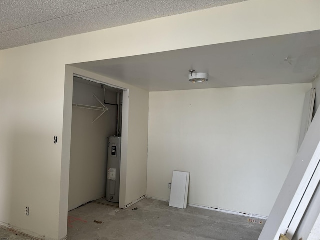 interior space with a closet and water heater