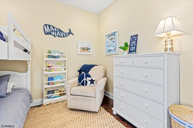 bedroom with light wood-type flooring and baseboards