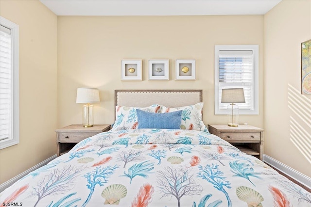 bedroom featuring baseboards