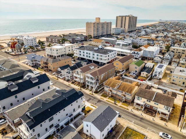 bird's eye view with a view of the beach and a water view