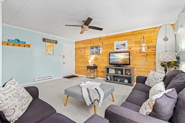 carpeted living area featuring a baseboard radiator, ornamental molding, ceiling fan, wood walls, and baseboards