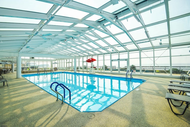 community pool featuring a patio and a lanai