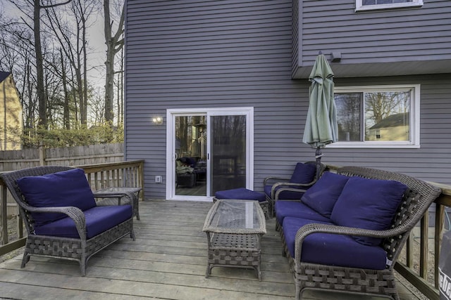 wooden deck featuring fence and outdoor lounge area