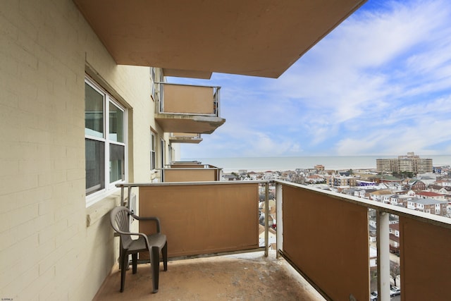 balcony featuring a water view