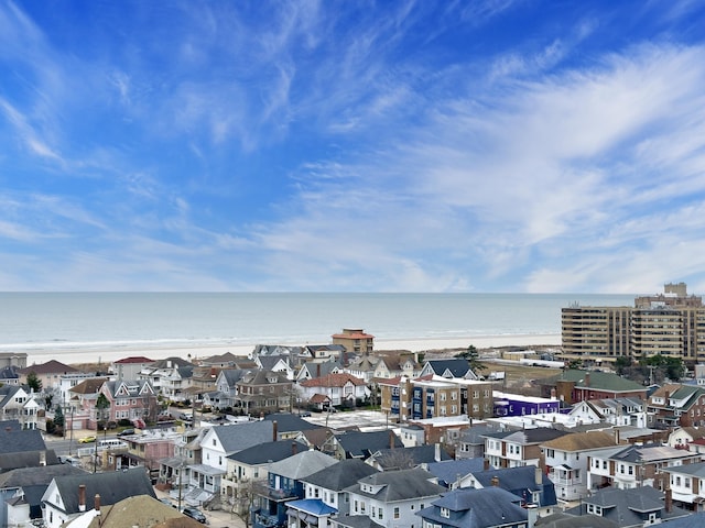 birds eye view of property with a water view and a residential view