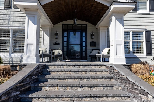 property entrance featuring covered porch