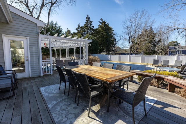 wooden terrace featuring outdoor dining area, a fenced backyard, and a pergola