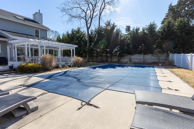 view of pool with a fenced in pool, a fenced backyard, a patio, and a pergola