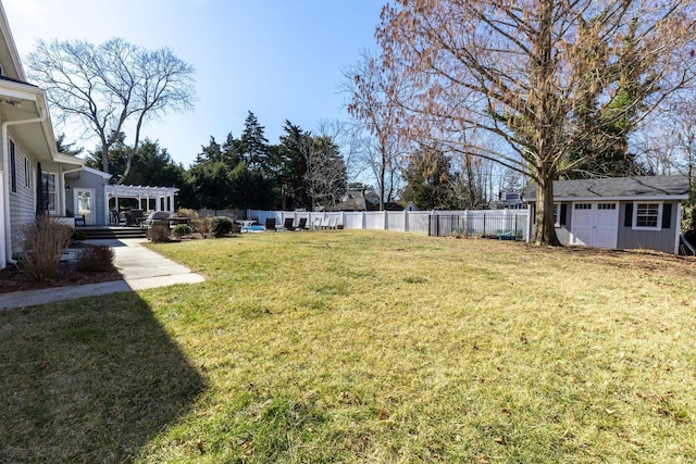 view of yard with fence private yard, a storage shed, a pergola, and an outbuilding