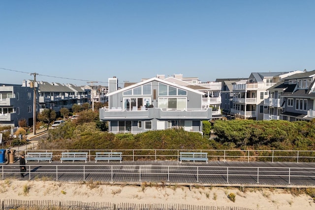 rear view of property with a residential view