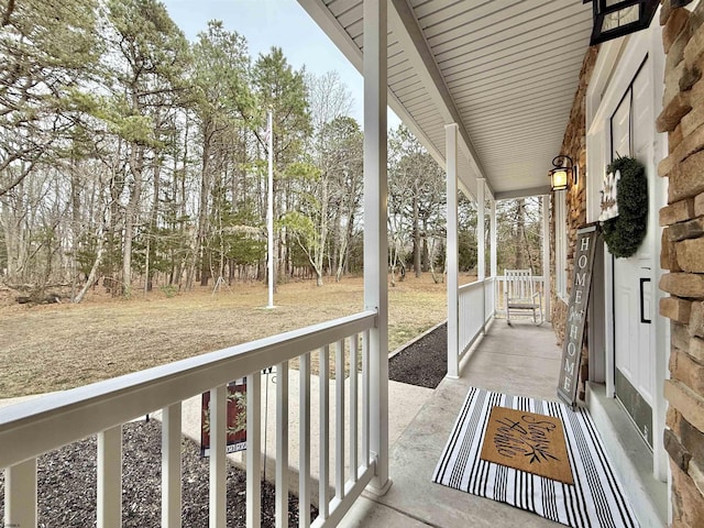 wooden terrace with a porch