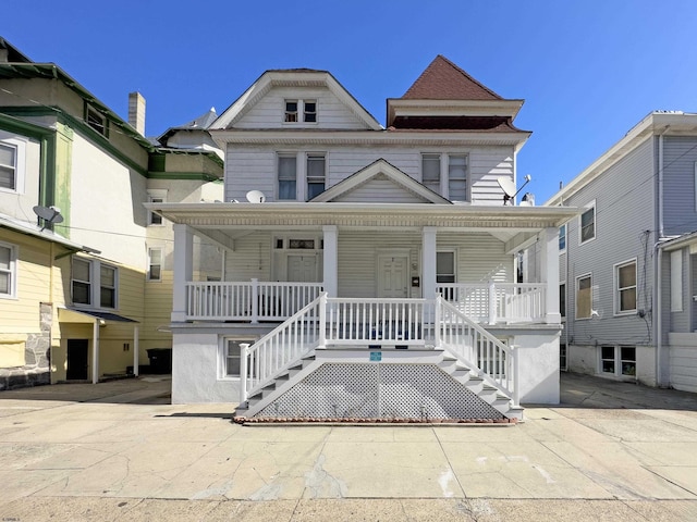 view of front facade with covered porch and stairs