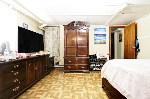 bedroom featuring a baseboard heating unit