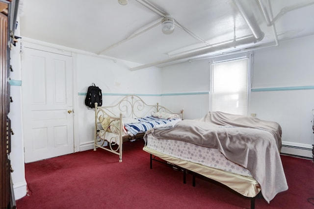 bedroom featuring carpet and baseboard heating