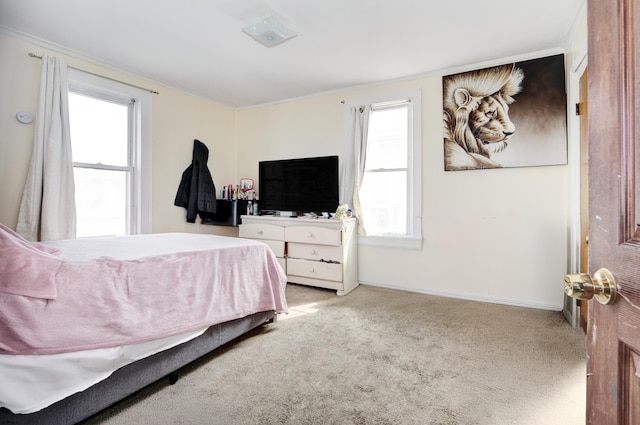 bedroom with carpet and baseboards