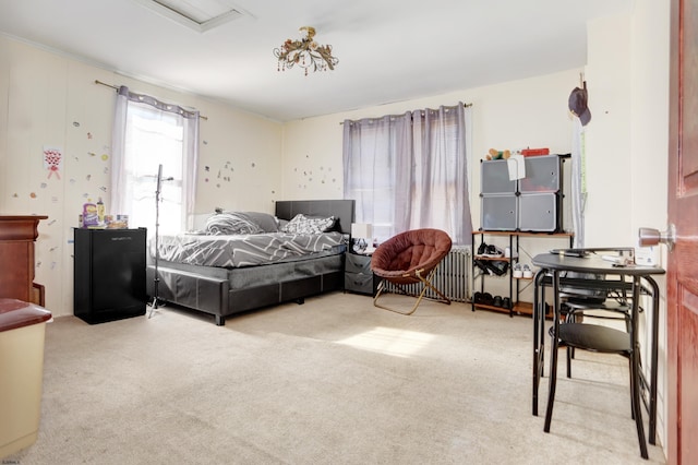 bedroom with radiator heating unit and carpet flooring