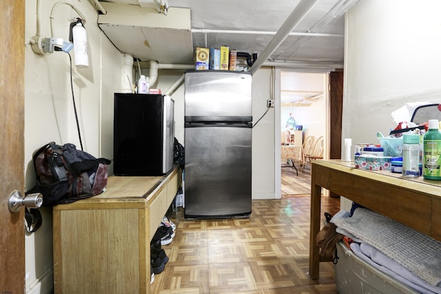 kitchen featuring freestanding refrigerator