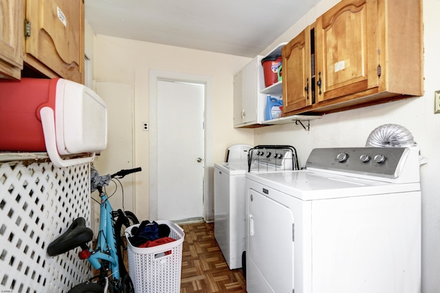 laundry room featuring cabinet space and washing machine and dryer