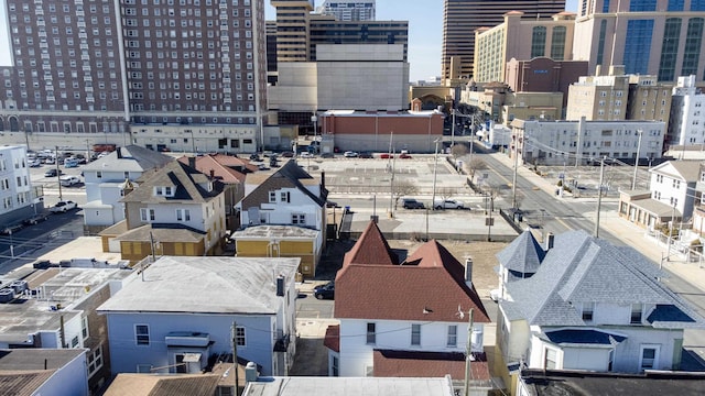 birds eye view of property featuring a city view