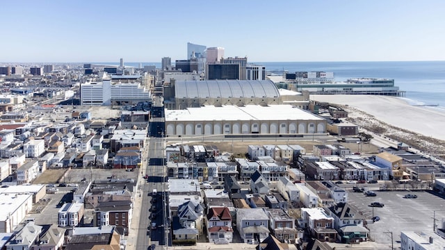 bird's eye view featuring a water view and a city view