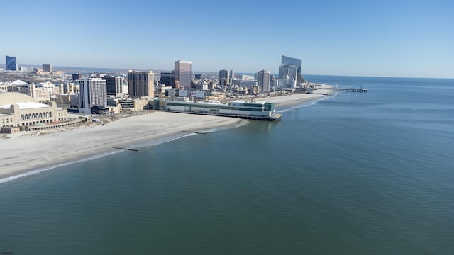 exterior space featuring a water view, a beach view, and a city view