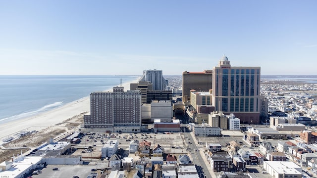 view of city featuring a water view and a beach view