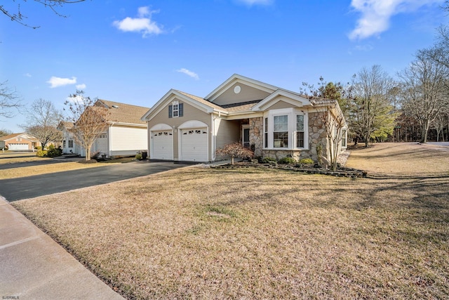 view of front of property featuring stone siding, driveway, and a front lawn