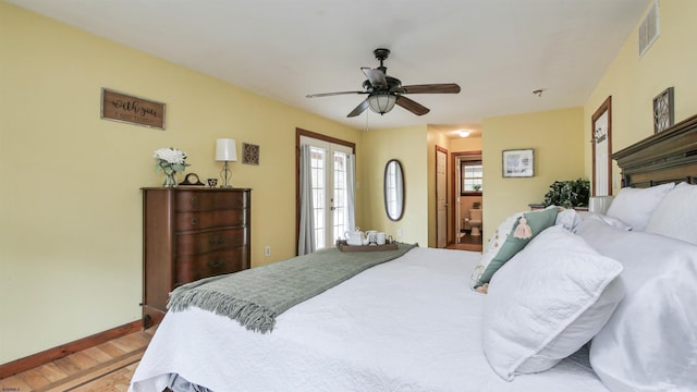 bedroom featuring light wood-style flooring, a ceiling fan, visible vents, baseboards, and french doors