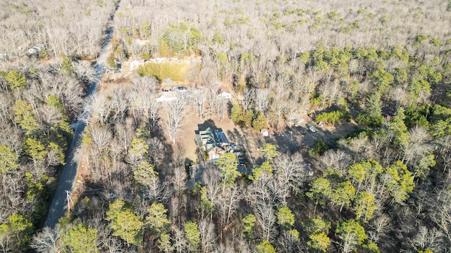 bird's eye view featuring a wooded view