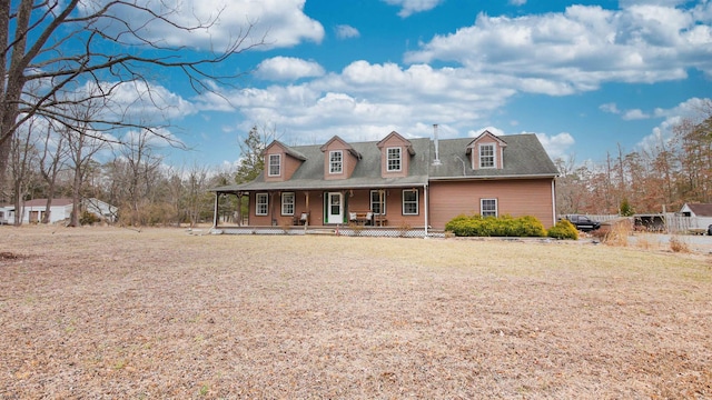 view of front of property with covered porch and a front lawn