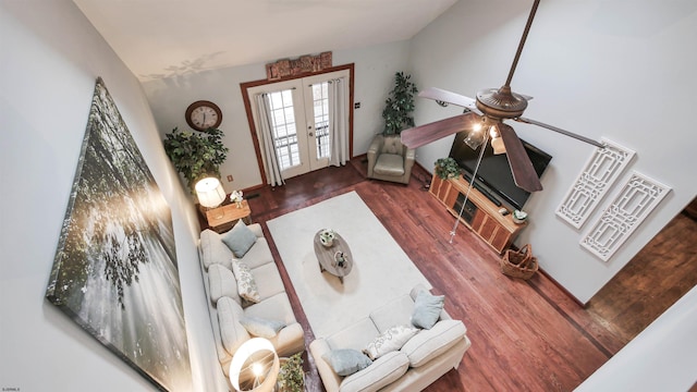 living room with french doors and wood finished floors