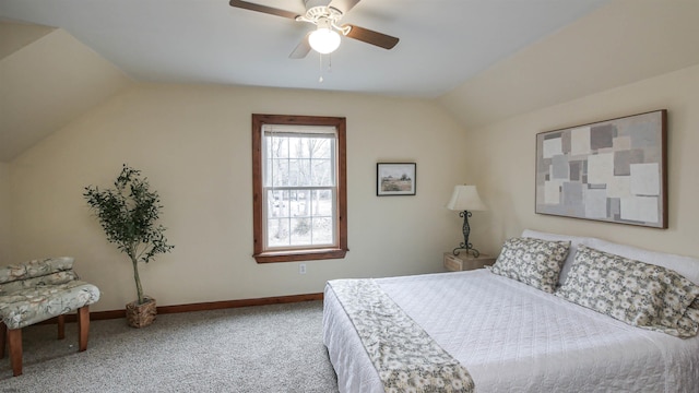 bedroom with carpet flooring, vaulted ceiling, baseboards, and ceiling fan