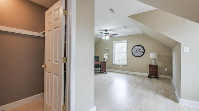 bonus room with baseboards, visible vents, a ceiling fan, wood finished floors, and vaulted ceiling