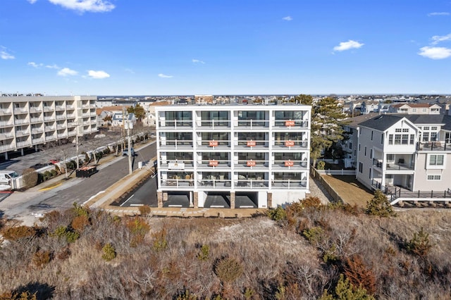 view of property featuring uncovered parking