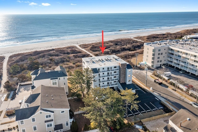 bird's eye view with a water view and a view of the beach