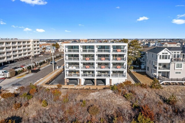 view of property featuring uncovered parking