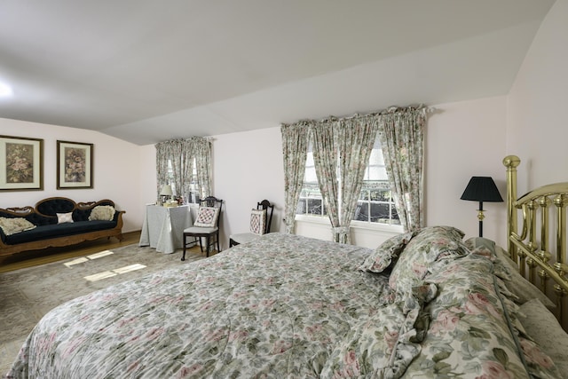 bedroom featuring lofted ceiling