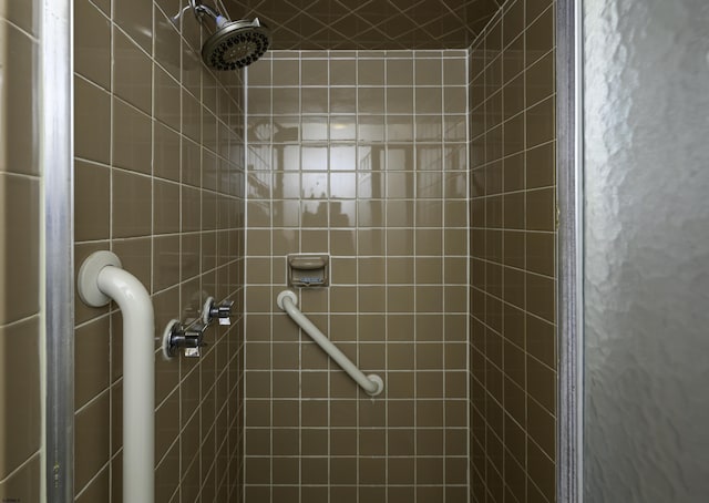 full bathroom with a tile shower