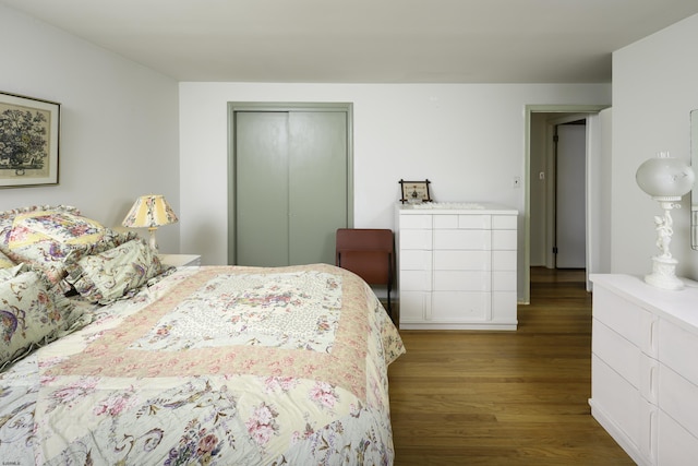 bedroom with a closet and wood finished floors