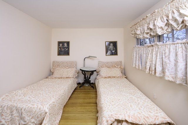 bedroom with wood finished floors