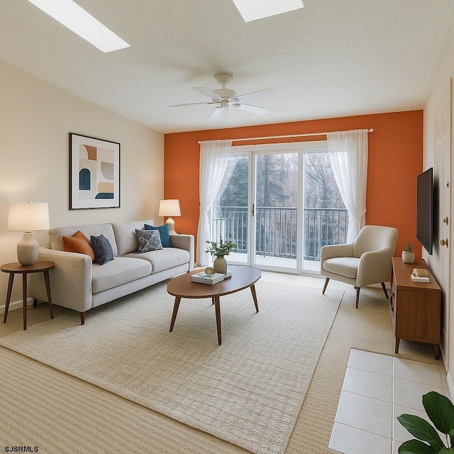 72 Arapaho Pl Unit 72, Absecon, NJ 08205 - carpeted living area featuring a skylight, a ceiling fan, and baseboards