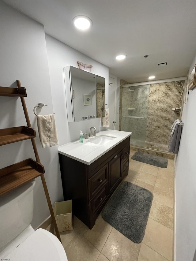 bathroom with recessed lighting, visible vents, toilet, a stall shower, and vanity