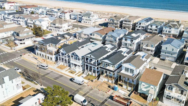 bird's eye view with a beach view, a residential view, and a water view