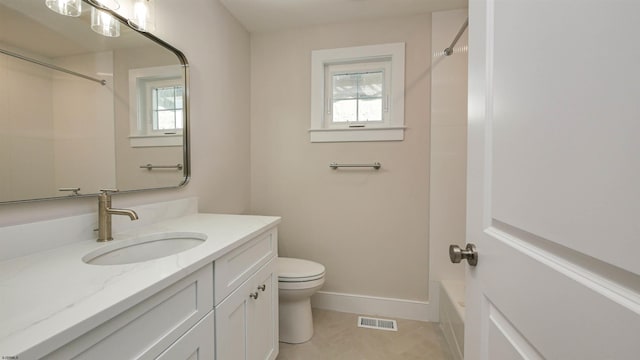 bathroom featuring a healthy amount of sunlight, visible vents, vanity, and toilet