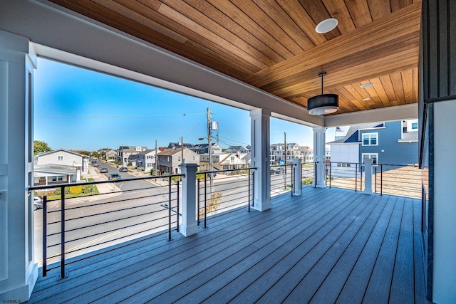 wooden terrace with a residential view