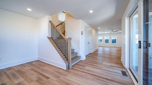 entryway with recessed lighting, visible vents, baseboards, stairs, and light wood-type flooring