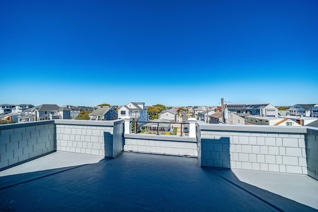 view of patio / terrace with a balcony and a residential view